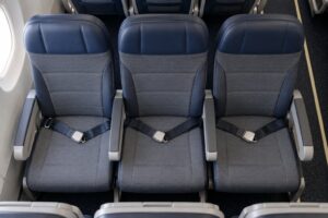who gets the armrest in the middle seat