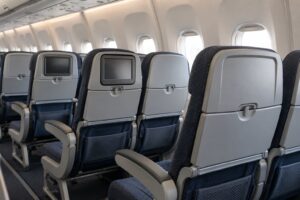 why airlines are removing seat back screens
