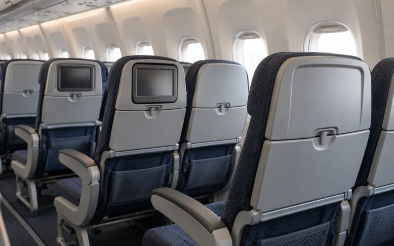 Why Airlines Are Removing Seat Back Screens in 2026 (Explained)